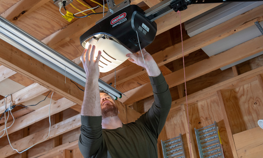 Man replacing the lens cover on a garage door opener