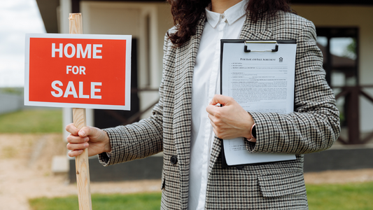 Home for sale sign in yard