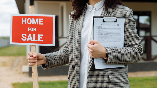 Home for sale sign in yard 