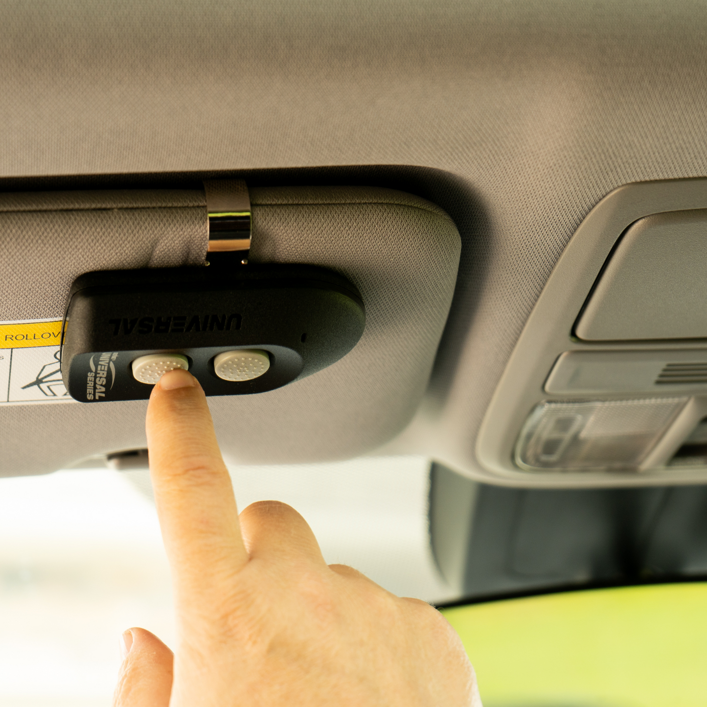 Two Button Universal Garage Door Opener Remote in car