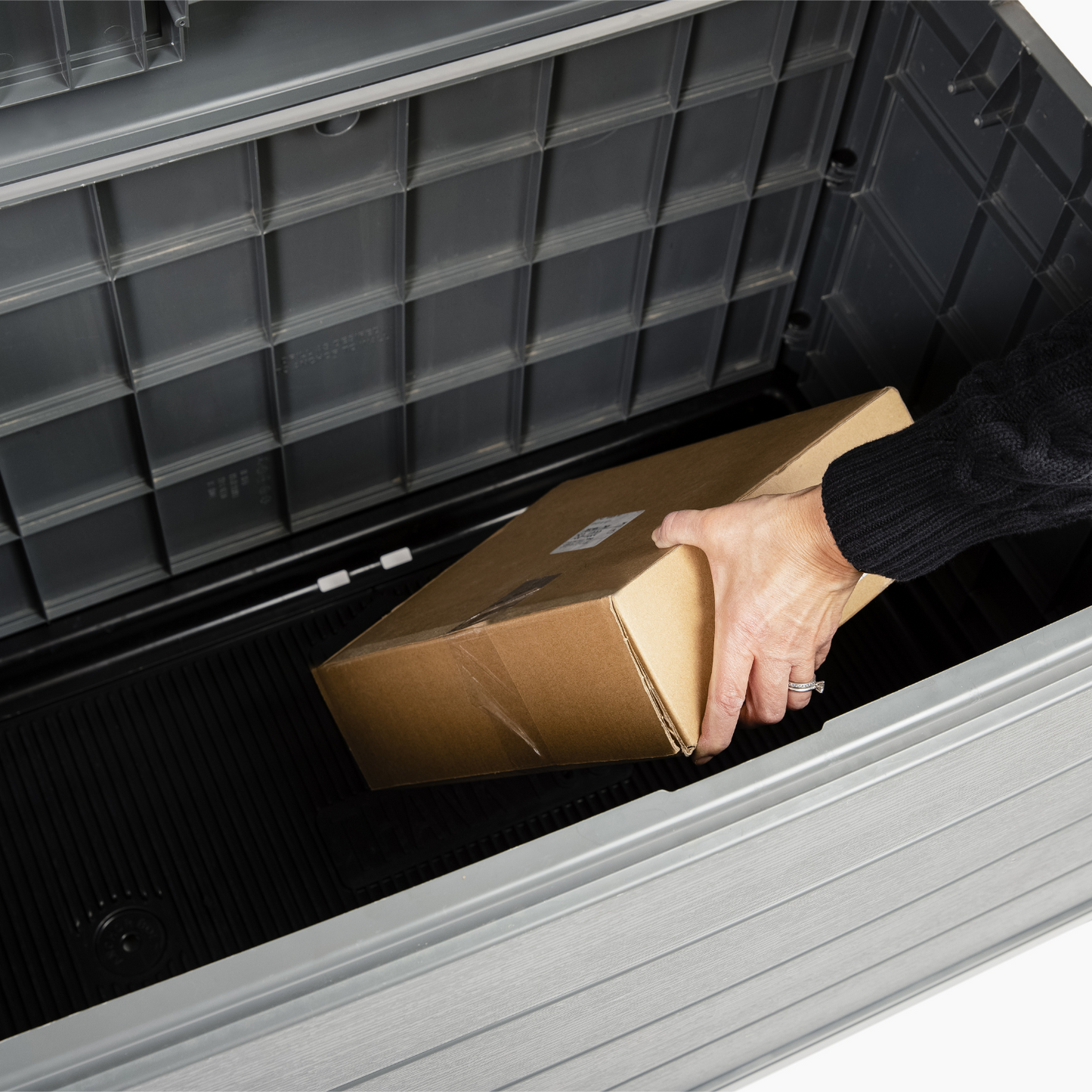 Package being placed in a BenchSentry Package Delivery Box
