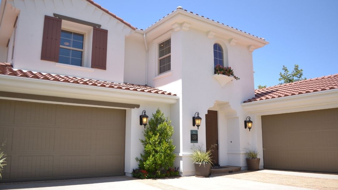 Two story house with two garage doors 