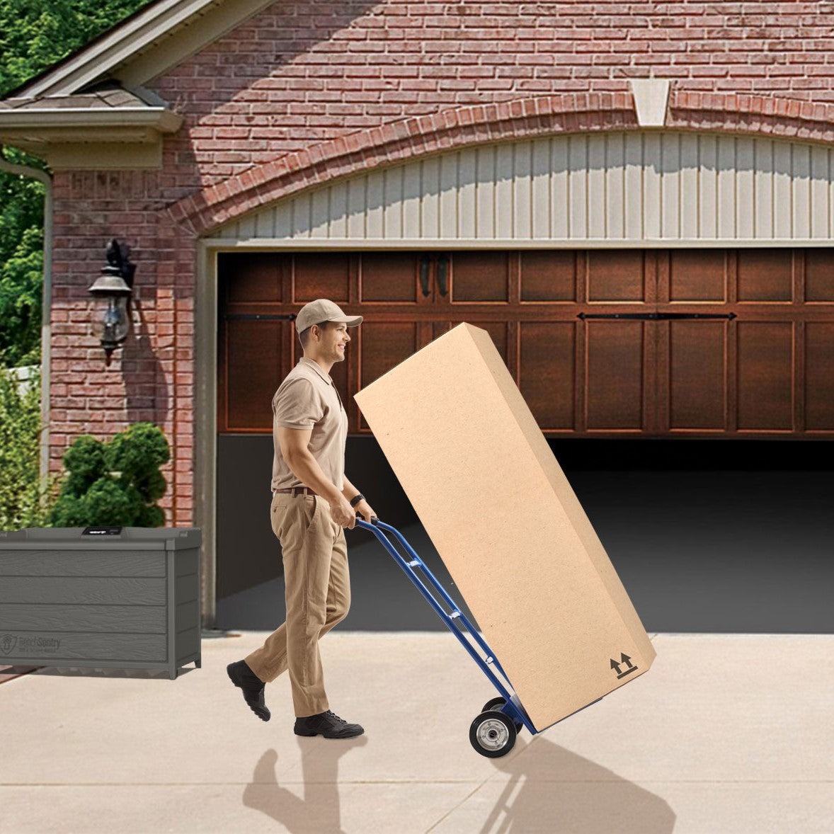 Delivery person with a large package on a dolly, delivering into a garage