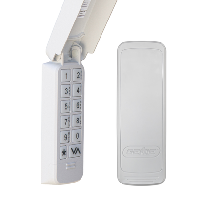 A white electronic keypad device with an attached antenna on the left and a matching rectangular receiver or sensor unit on the right, both shown on a plain white background. The right unit has the brand name GENIE embossed on it.